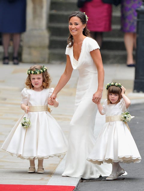 london, england   april 29  sister of the bride and maid of honour pippa middleton holds hands with grace van cutsem and eliza lopes as they arrive to attend the royal wedding of prince william to catherine middleton at westminster abbey on april 29, 2011 in london, england the marriage of the second in line to the british throne is to be led by the archbishop of canterbury and will be attended by 1900 guests, including foreign royal family members and heads of state thousands of well wishers from around the world have also flocked to london to witness the spectacle and pageantry of the royal wedding  photo by pascal le segretaingetty images