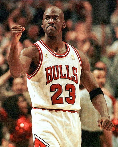 chicago, united states  michael jordan of the chicago bulls pumps his fist after scoring the game winning  basket in the fourth quarter 01 june during game one of the nba finals at the united center in chicago, il  the bulls defeated the utah jazz 84 82     afp photo vincent laforet photo credit should read vincent laforetafp via getty images