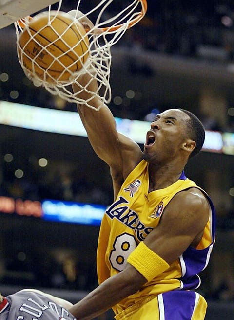 Kobe Bryant of the Los Angeles Lakers dunks the ba los angeles, united states kobe bryant of the los angeles lakers dunks the ball against the new jersey nets in the 3rd quarter of game one of the nba finals against 05 june 2002, at the staples center in los angeles, ca the lakers are defending champions and are looking to win their third championship in a row afp photo jeff haynes photo credit should read jeff haynesafp via getty images