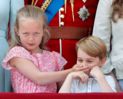 london, united kingdom   june 09 embargoed for publication in uk newspapers until 24 hours after create date and time savannah phillips puts her hand over prince george of cambridges mouth as they stand on the balcony of buckingham palace during trooping the colour 2018 on june 9, 2018 in london, england the annual ceremony, involving over 1400 guardsmen and cavalry, is believed to have first been performed during the reign of king charles ii the parade marks the official birthday of the sovereign, even though the queens actual birthday is on april 21st photo by max mumbyindigogetty images