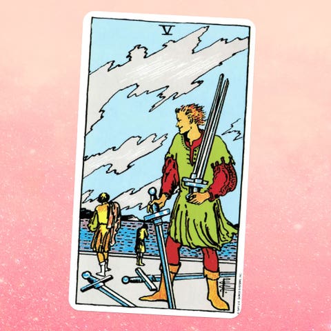 the tarot card the five of swords, showing a person carrying three swords with two more on the ground two more people can be seen in the distance in the background