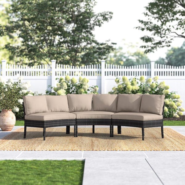 Burmeister Wide Outdoor Wicker Curved Patio Sectional with Cushions