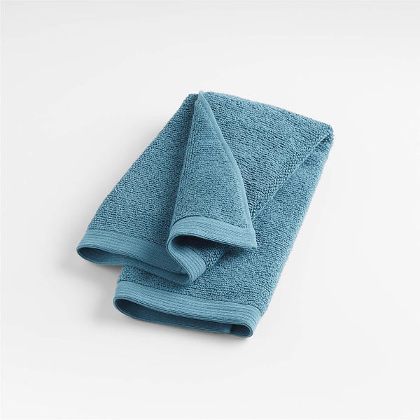 https://media.hearstapps.com/vader-prod.s3.amazonaws.com/1666023498-teal-anti-microbial-organic-cotton-hand-towel.jpg?width=600